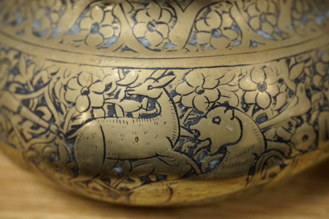 A group of Islamic and Indian brass bowls, largest 15cm in diameter